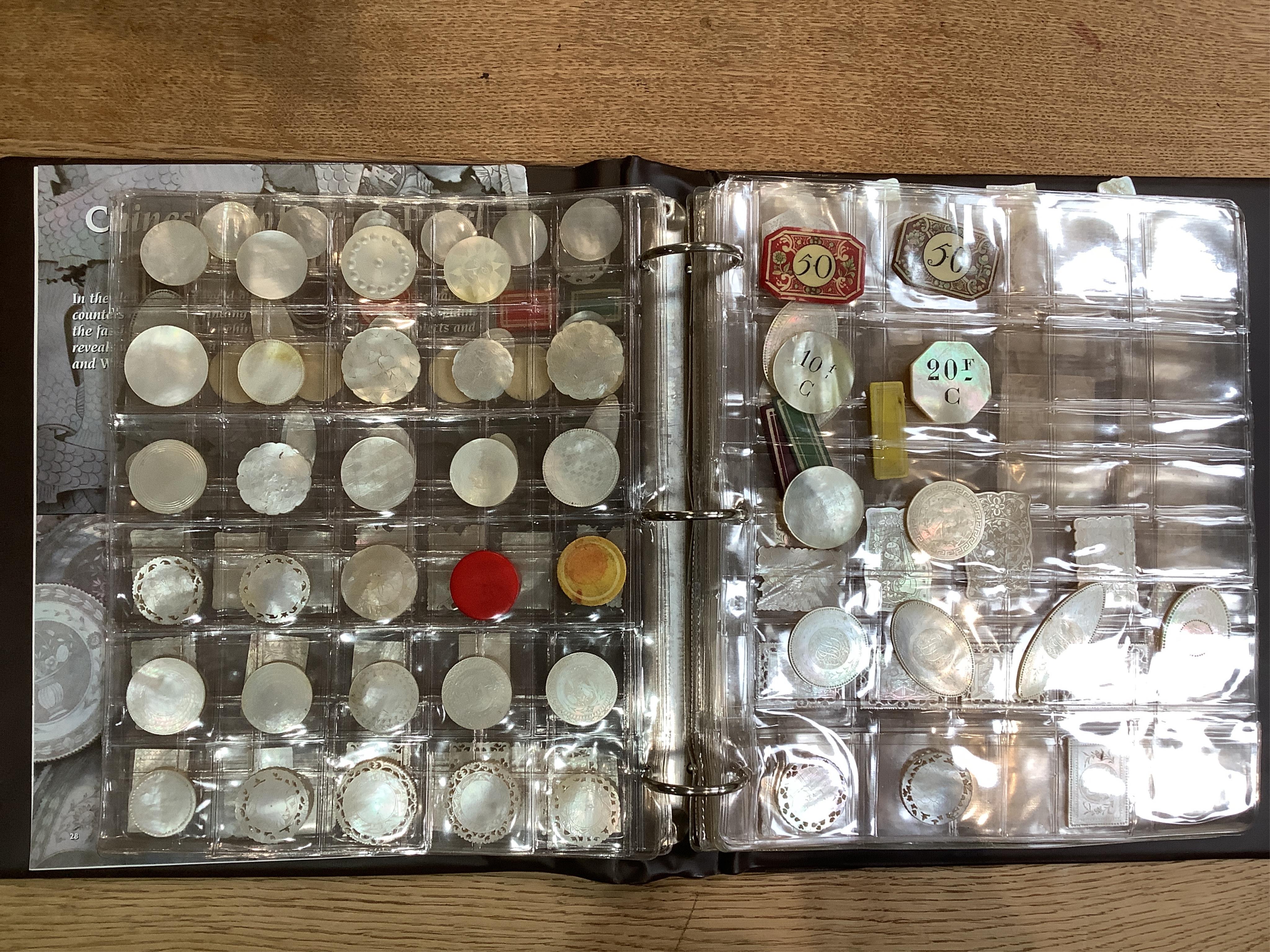 An extensive collection of Chinese mother of pearl gaming counters, in an album. Condition - the majority of the counters in good condition, occasional examples with tiny splinter edge chips